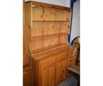 PINE FRAMED DRESSER, THE TOP FITTED WITH TWO FIXED SHELVES, THE BASE WITH THREE DRAWERS OVER THREE