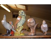 THREE STUDIO POTTERY GLAZED BIRD ORNAMENTS TOGETHER WITH A FURTHER RESIN MODEL OF AN OWL (4)