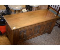 OAK FRAMED PANEL FRONTED COFFER WITH LIFT UP TOP AND DROP FRONT