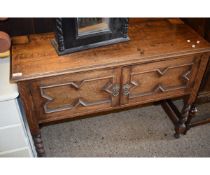 EARLY 20TH CENTURY OAK FRAMED SIDEBOARD WITH TWO CUPBOARD DOORS WITH GEOMETRIC DESIGNS ON BARLEY