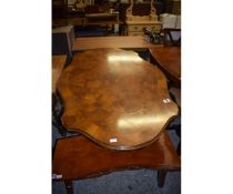 WALNUT SEGMENTED TOP LOZENGE SHAPED DINING TABLE WITH SINGLE PEDESTAL ON A SHAPED AND CARVED