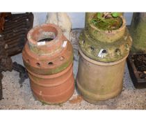 TWO VARYING SIZED TERRACOTTA CHIMNEY POTS