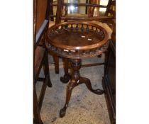 REPRODUCTION MAHOGANY CIRCULAR TABLE WITH GALLERIED EDGE WITH TURNED COLUMN ON A CARVED TRIPOD BASE