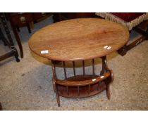 TEAK FRAMED OVAL TOPPED SIDE TABLE WITH BUILT IN MAGAZINE RACK