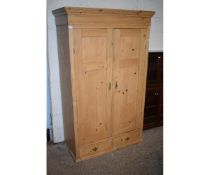 WAXED PINE DOUBLE DOOR WARDROBE WITH TWO DRAWER BASE