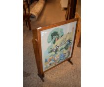 MID-20TH CENTURY OAK FRAMED EMBROIDERED PANELLED METAMORPHIC SPARK GUARD AND TABLE