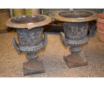 PAIR OF CAST IRON TWO HANDLED GARDEN URNS