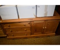 PINE FRAMED DRESSER BASE WITH THREE DRAWERS BESIDE TWO CUPBOARD DOORS
