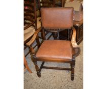 OAK FRAMED BROWN LEATHERETTE UPHOLSTERED ARMCHAIR