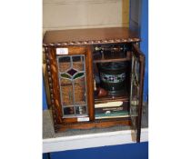 OAK FRAMED SMOKER'S CABINET WITH TWO LEADED AND GLAZED DOORS WITH FITTED INTERIOR WITH A QUANTITY OF