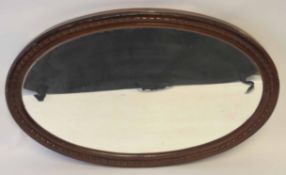 Painted oval mirror with ribbon design