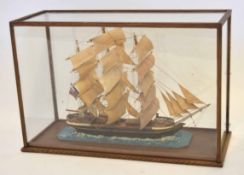 Vintage model of a three-masted vessel in a glazed display case, 48cm long