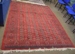 Bokhara style Caucasian carpet, central panel of six lines of lozenges interspersed by geometric