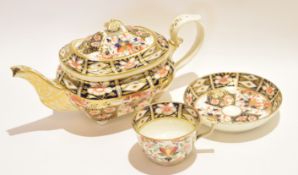 19th century Derby tea pot and cover together with a Derby cup and saucer, both decorated in Imari