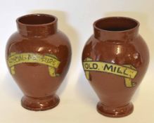 Pair of vintage stoneware tobacco urns of baluster form inscribed "Old Mill" and "Special mixture",