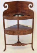 Late 18th century mahogany two-tier corner wash stand, scroll pediment over a fitted upper shelf,