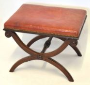 19th century mahogany X-frame stool, leather seat over a plain support joined by a ring turned