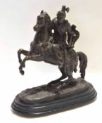 Spelter cast metal group of a mounted knight on a rearing horse, 30cm high