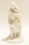 Continental white porcelain group of a lady with child on her back, 20cm high