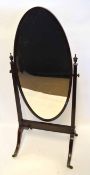 19th century mahogany cheval mirror, plain oval mirror raised on spreading supports crested with