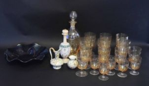 Venetian style glass decanter and stopper with assorted glasses, all with a gilt scrolling design,