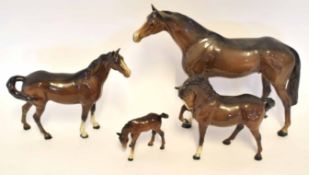 Group of three Beswick horses and a foal, the largest horse 26cm high (4)