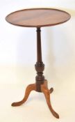 Mahogany pedestal table, circular top raised on a balustered support and tripod base, 44cm diam