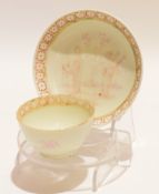 Lowestoft tea bowl and saucer decorated in puce with Chinese figures in a garden (some wear), the