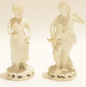 Two 19th century Derby blanc de chine figures of children, the boy holding a puppy, the girl a lamb,