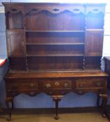 Early 19th century oak dresser, plate rack back with two compartments and the base with three frieze