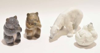 Group of Royal Copenhagen models of a polar bear and other bears in various poses, the largest