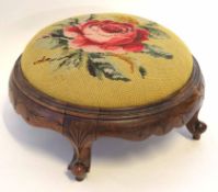 Late Victorian stained beech circular foot stool with grospoint wool embroidered seat raised on four
