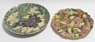 Wealden ware plate with pie-crust rim, together with a 19th century Art Pottery plate, largest