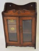 Late 19th/early 20th century oak smoker's cabinet, front with two bevelled glass inset panelled