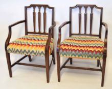 Set of six Hepplewhite style mahogany carver chairs, backs each with reeded vase shaped spindles,