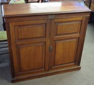 Late 19th century/early 20th century American walnut cupboard, two panelled doors enclosing a fitted