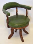Early 20th century oak and green leather upholstered swivel office chair