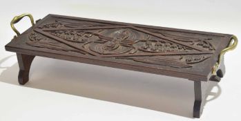 Unusual small rectangular oak tray, the top carved with geometric foliage etc and bearing a scroll