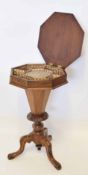 Victorian mahogany pedestal work table of octagonal form, moulded edge and lifting lid raised on a