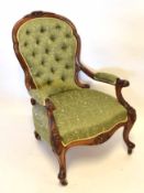 Victorian walnut gent's chair upholstered in patterned green button back