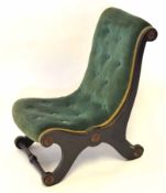 Victorian ebonised nursing chair upholstered in green button back, applied throughout with foliate