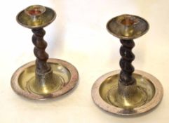 Pair of silver plated mounted and oak twisted stem candlesticks in the Arts & Crafts style, 20cm