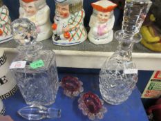 TWO CLEAR GLASS DECANTERS TOGETHER WITH TWO CRANBERRY GLASS SALT CELLARS (4)