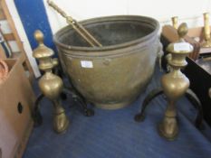 BRASS TWO-HANDLED LION HEAD BUCKET TOGETHER WITH TWO SETS OF FIRE DOGS