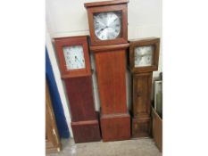 TWO TEAK FRAMED SMALL PROPORTIONED GRANDMOTHER CLOCKS TOGETHER WITH A FURTHER OAK FRAMED EXAMPLE (