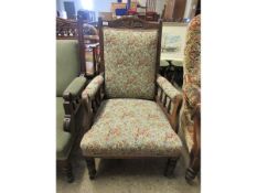 EDWARDIAN WALNUT ARMCHAIR WITH FLORAL UPHOLSTERY AND TURNED FRONT LEGS