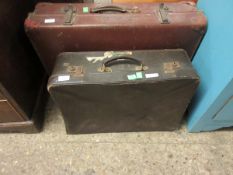 TWO REXINE COVERED SUITCASES