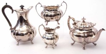 Early 20th century four-piece tea set comprising hot water tea pot, sugar basin and milk jug, each