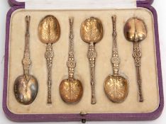 Cased set of six George V silver gilt coffee spoons each modelled as an anointing spoon in a silk