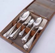 Early 20th century oak cased canteen of flatware comprising six each dinner and dessert forks,